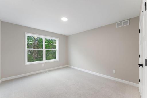 (Photo of a similar home, actual finishes may vary) Three secondary bedrooms located on the second floor surround the upstairs loft and provide personal space for family members.