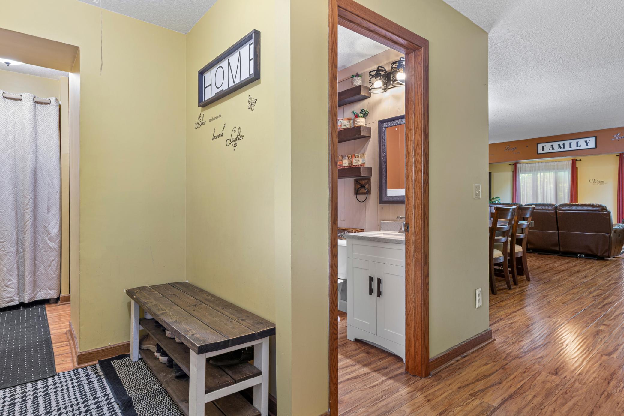 Foyer entry with easy access to garage