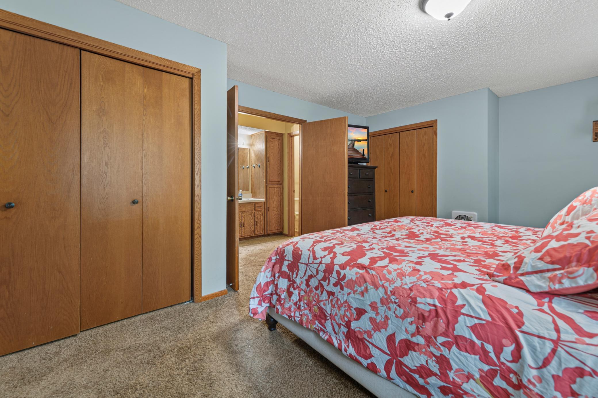 Primary bedroom opens to the full bath in the hall