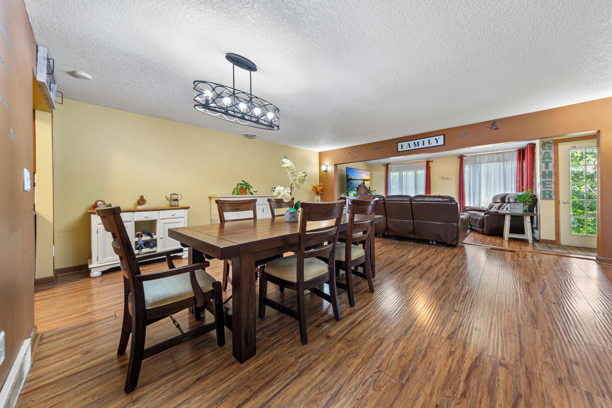 Open living/dining room that flows into the sun porch