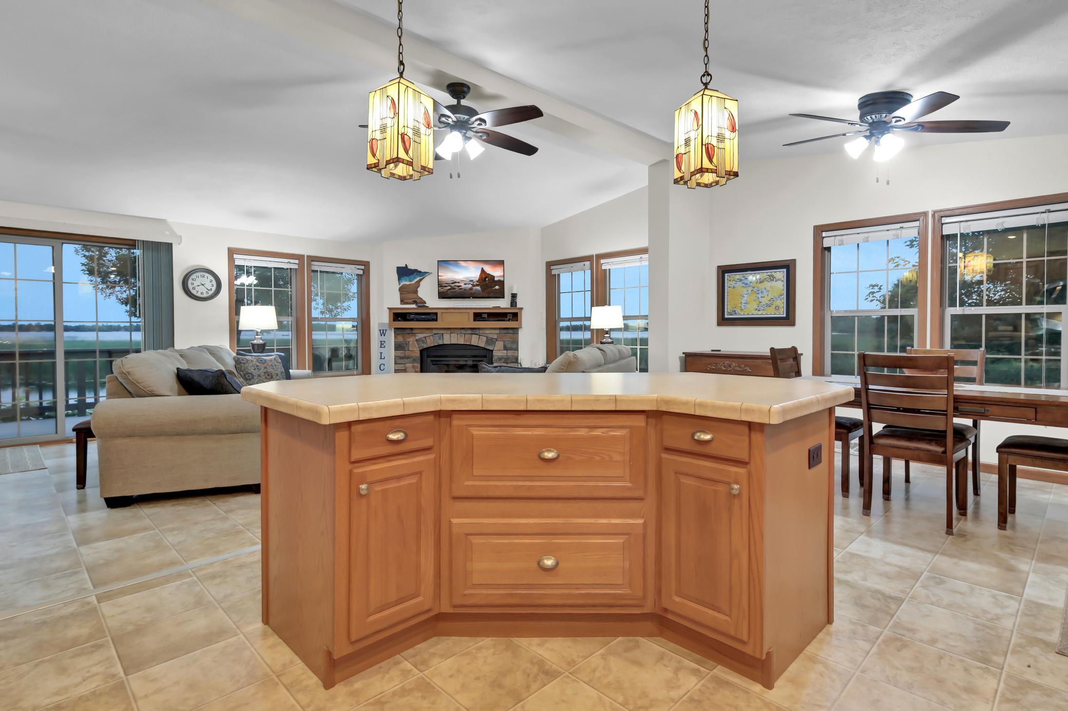 view of living room and fireplace from kitchen