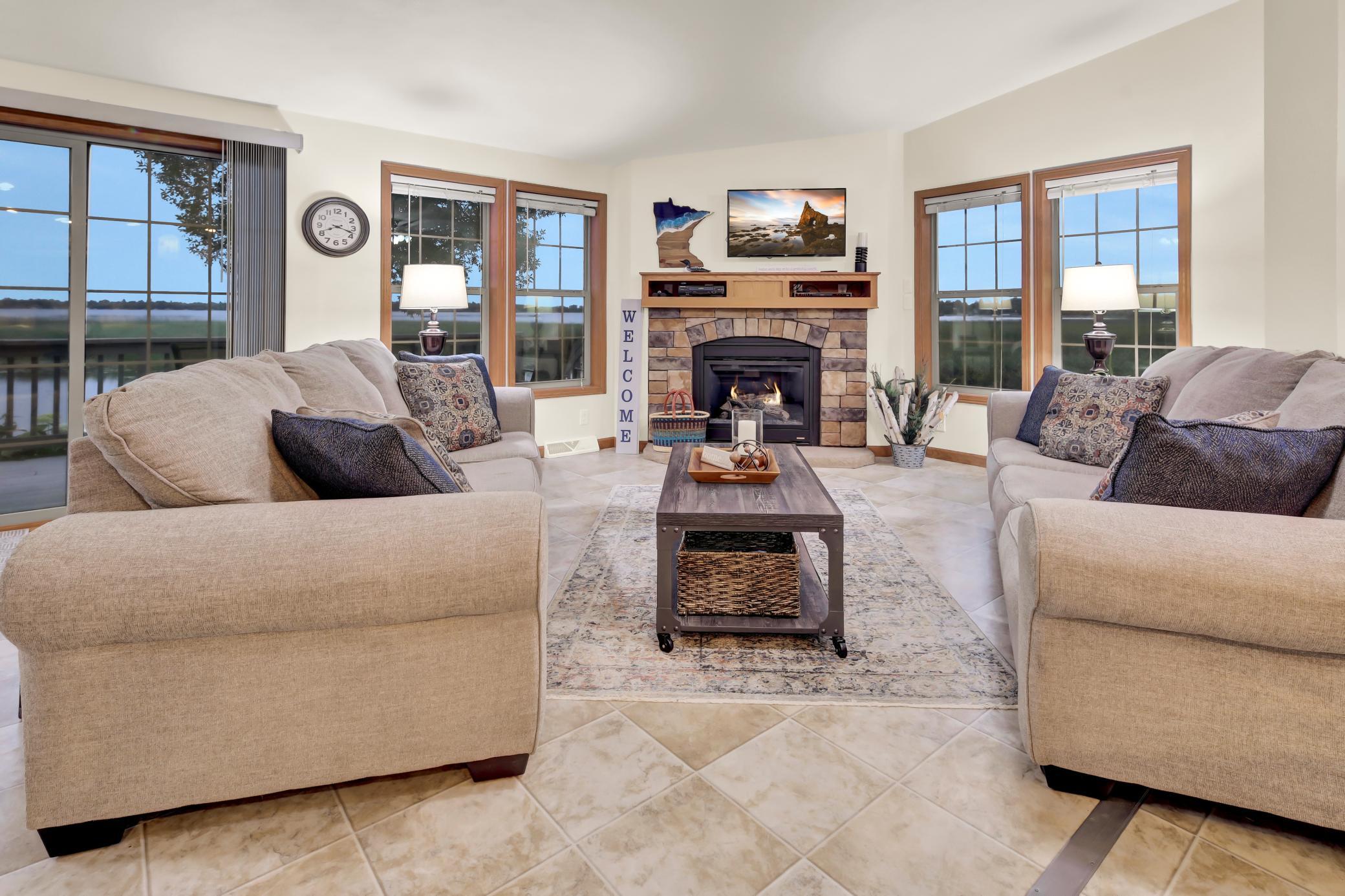 Living room with fireplace - lake views from all windows