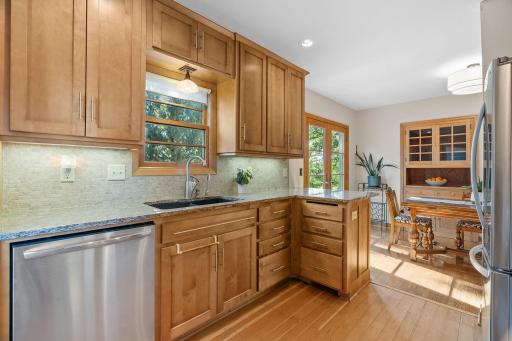 Solid wood cabinets, granite countertops, tile backsplash, stainless steel appliances.