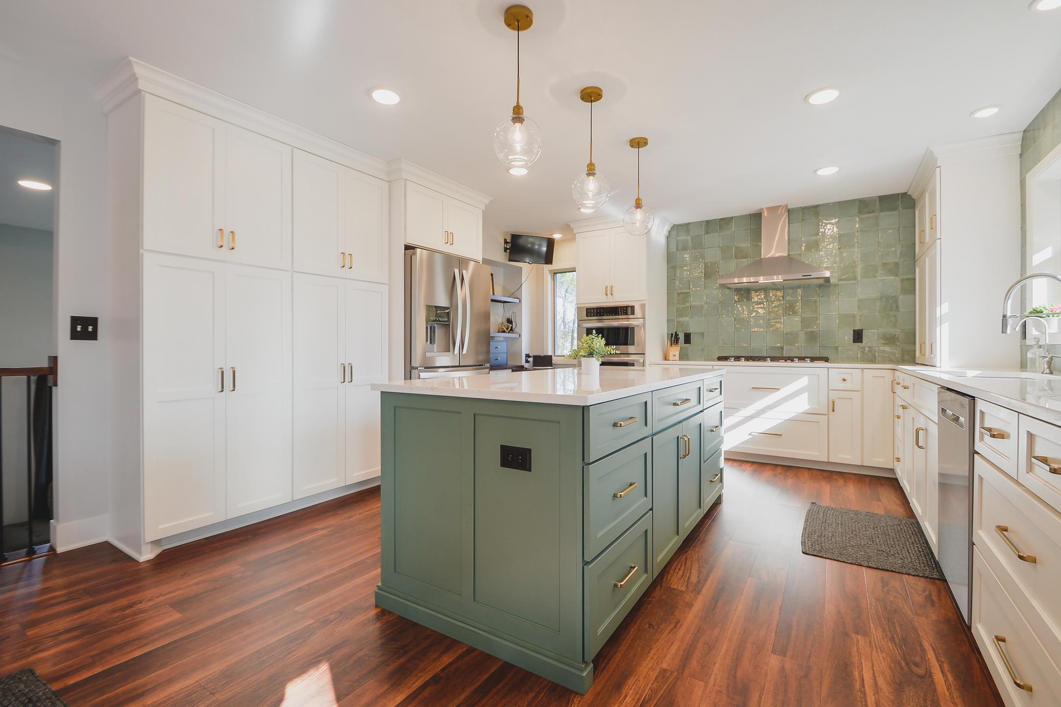Fully remodeled kitchen (2020) featuring custom cabinetry with pull-outs and drawers, quartz countertops & tile backsplash