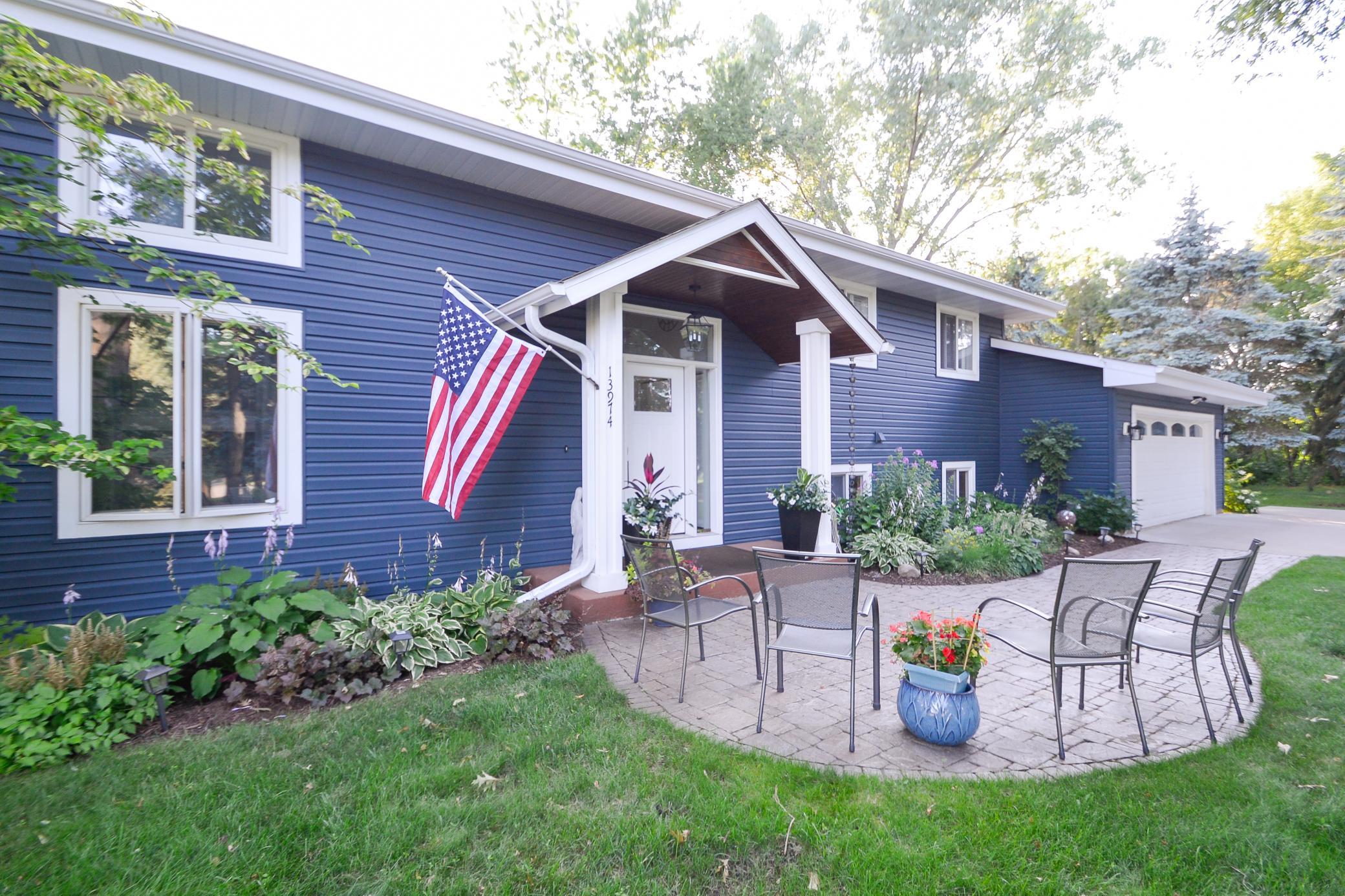Inviting front porch with vaulted wood ceiling