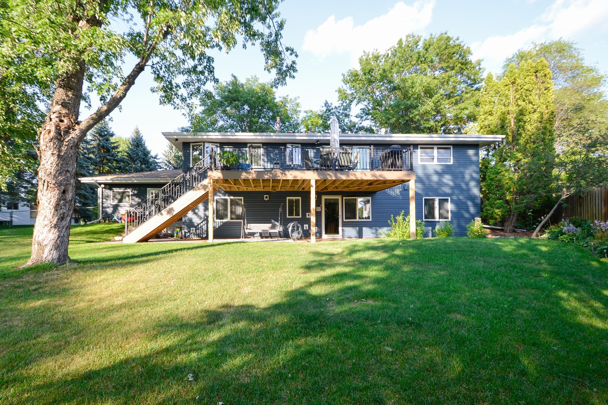 Professionally installed maintenance-free deck (2025) with beautiful backyard views