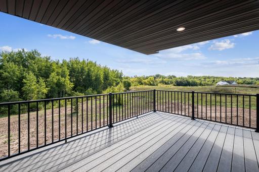 Covered maintenance free deck and railing with nice Westerly views - *Photo of previous spec home*
