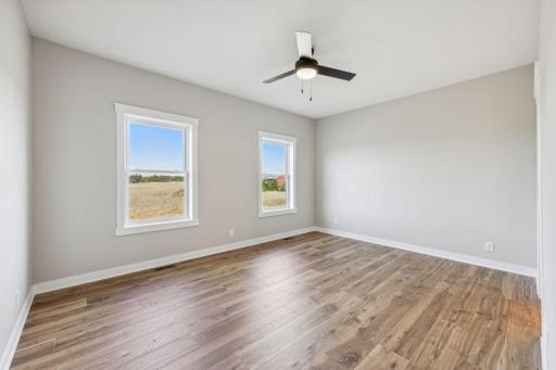 Primary bedroom with window facing West for nice sunset views! *Photo of previous spec - colors may vary on current spec home*