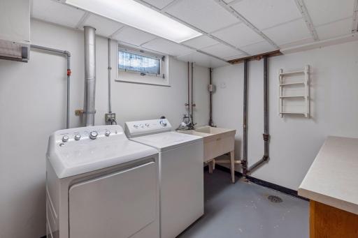 Lower level laundry room with storage areas