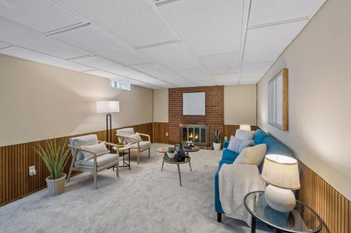 Lower level family room with brick fireplace