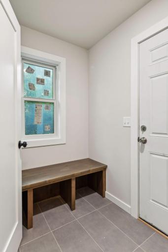 Mud room off kitchen leads to garage