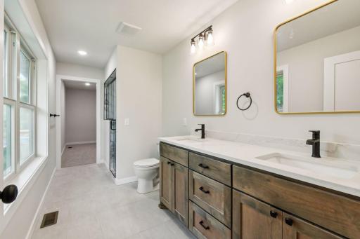 Double sink custom built vanity with quartz counters