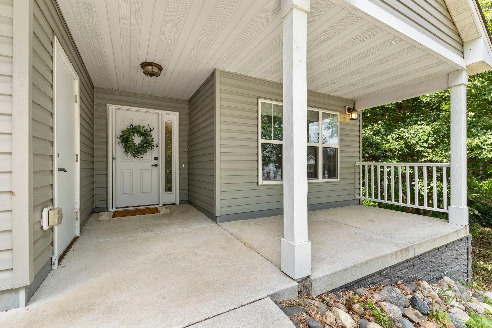 Imagine your morning cup of coffee on this darling front porch!