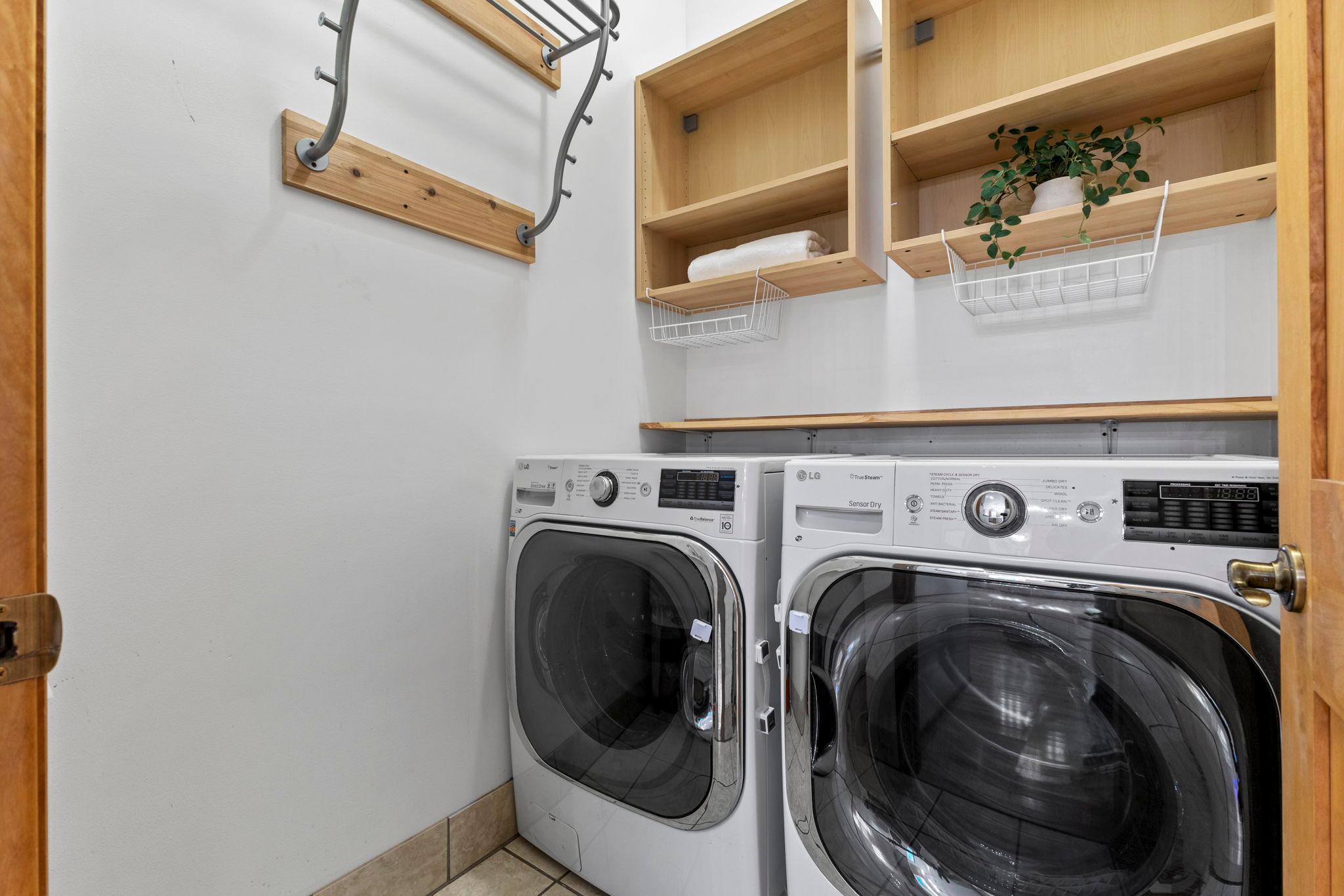 Laundry room comes with cabinet space for all your storage needs and a SINK!