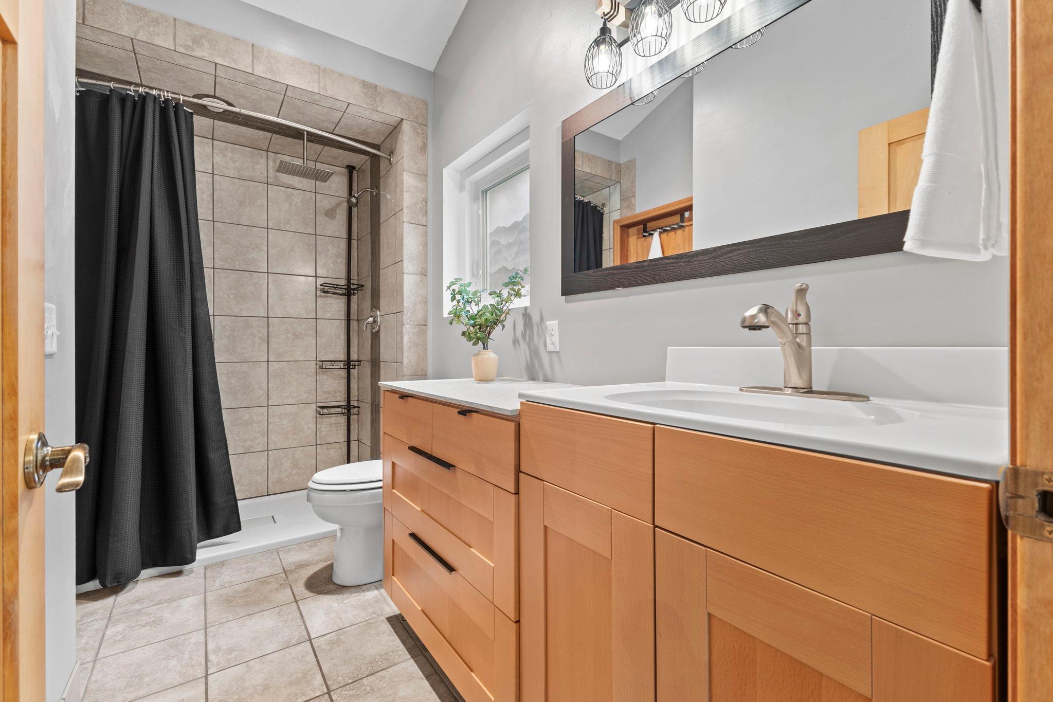 Includes a bath ensuite with tile floor and a dual-head shower!