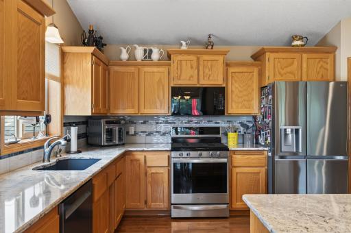 A spacious layout gives this kitchen plenty of room to spread out. Stainless steel appliances and abundant storage complete the space.