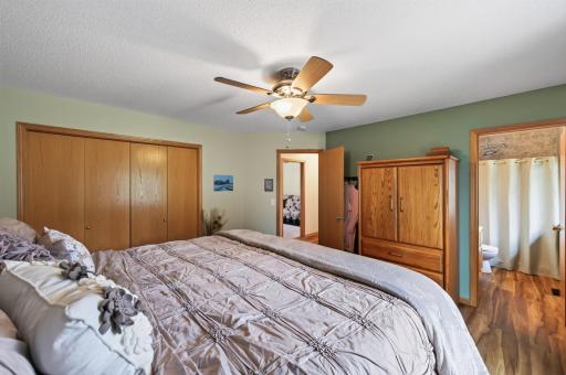 The primary suite offers comfort and functionality. Plenty of closet space and natural light create a relaxing retreat.
