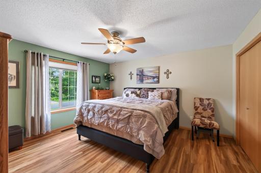 Retreat to the spacious primary bedroom. With generous room for your furnishings, it's the perfect place to unwind.