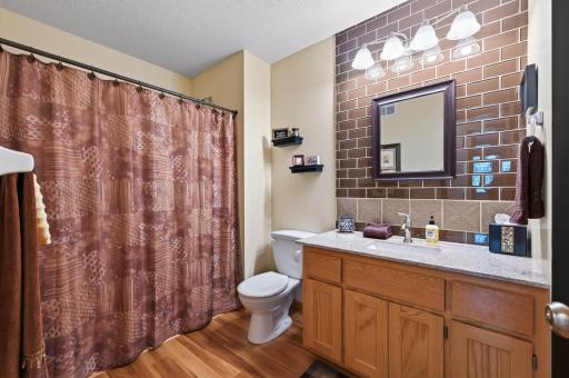 Start your day in this spacious full bathroom. A large vanity and functional layout make busy mornings easier.