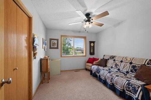 A generously sized secondary bedroom offers comfort for family or guests.