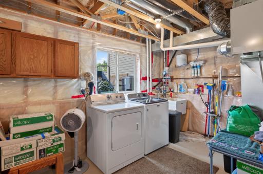 The dedicated laundry and utility area offers excellent storage and workspace. Functional and ready for everyday living.