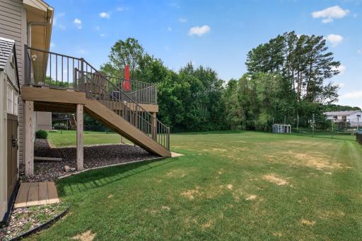 The backyard offers room to run, play, and entertain. A wonderful extension of your living space.