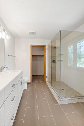 View into Primary Bathroom with Walk-in Closet