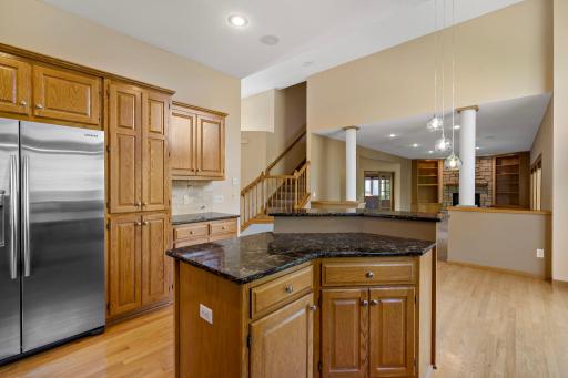 View into Kitchen, Informal Dining Area, Foyer, and Family Room