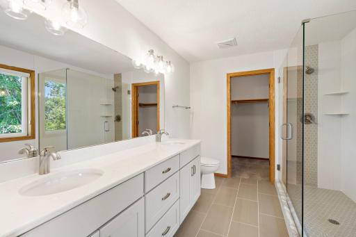 View into Primary Bathroom with Walk-in Closet