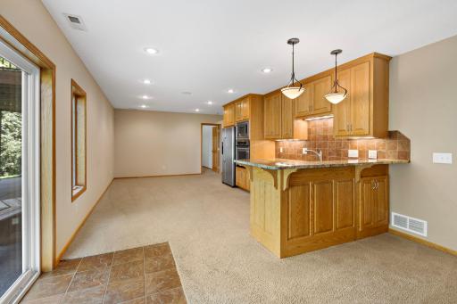 View of lower-level Rec Room with Kitchenette and Walk-out Patio