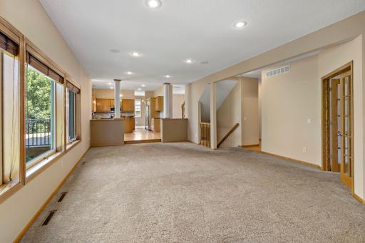 View from Family Room into Informal Dining Area and Kitchen