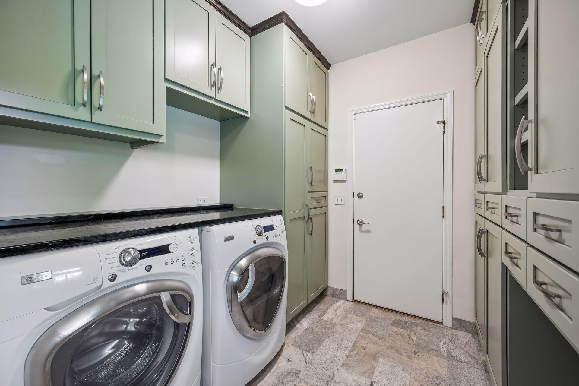 Convenient main floor laundry features plenty of storage