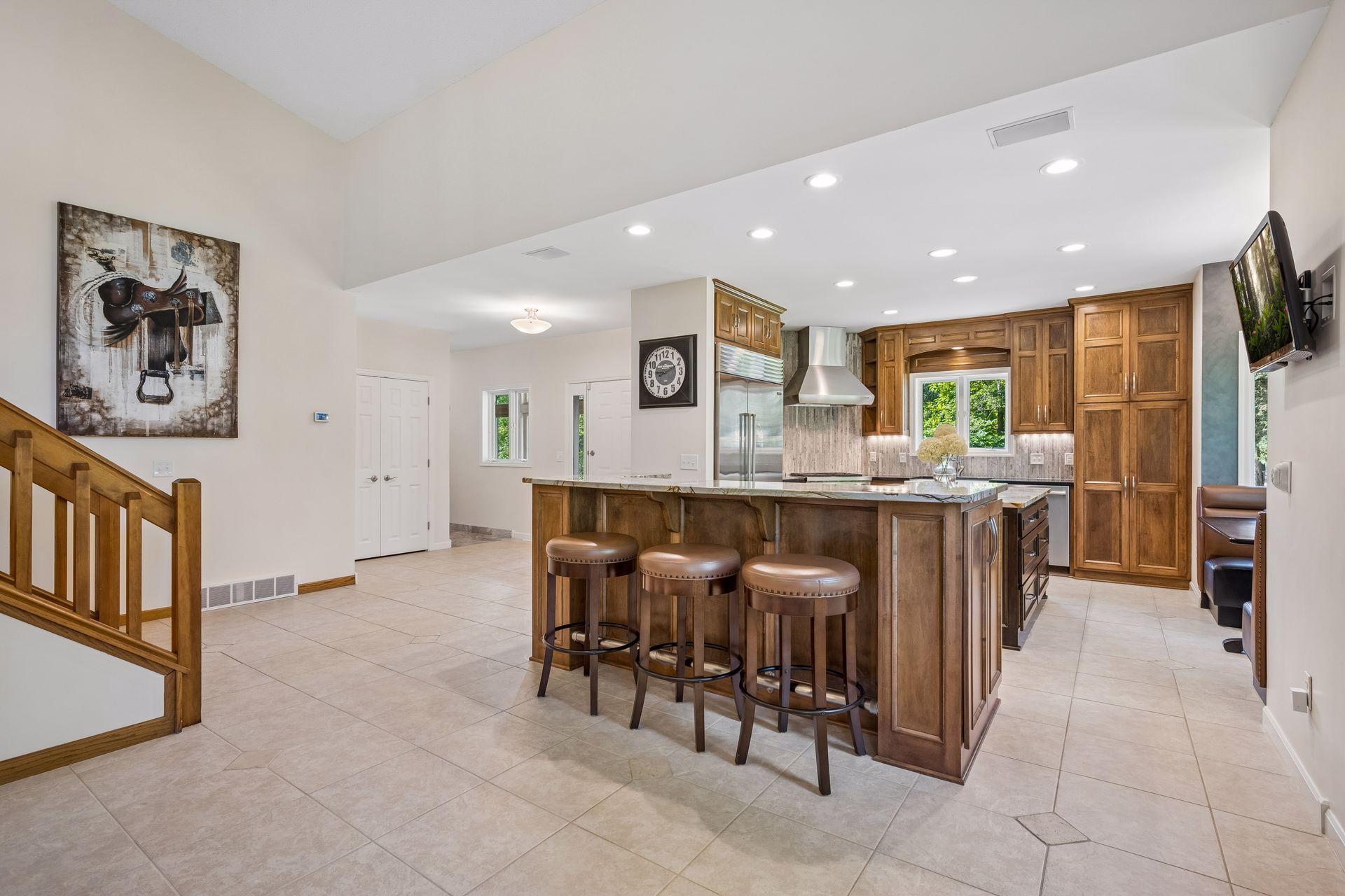 Custom matching upholstered barstools will remain with the home
