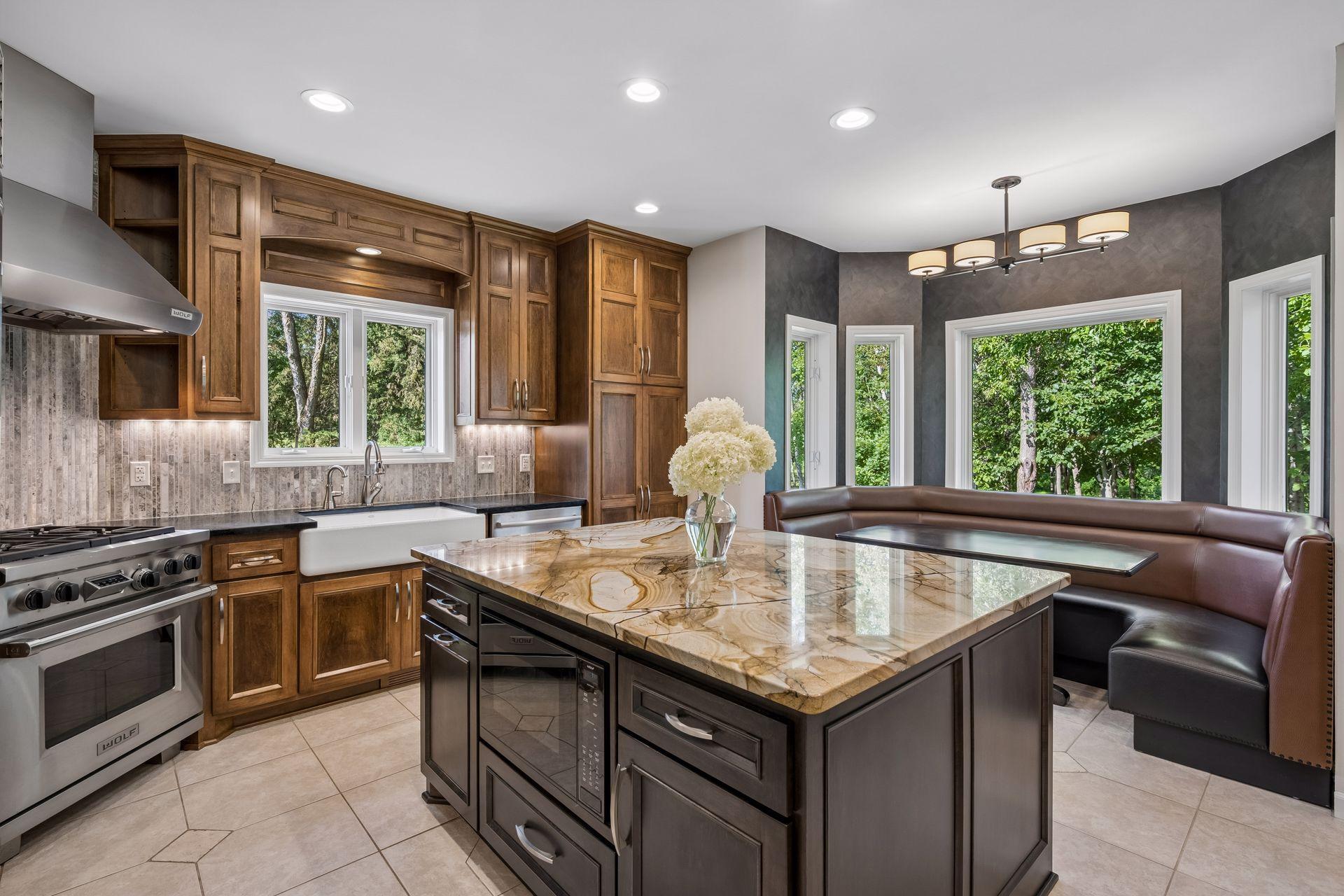 Brazilian granite counter tops, high-end Wolf gas range and ventilation hood, built-in microwave