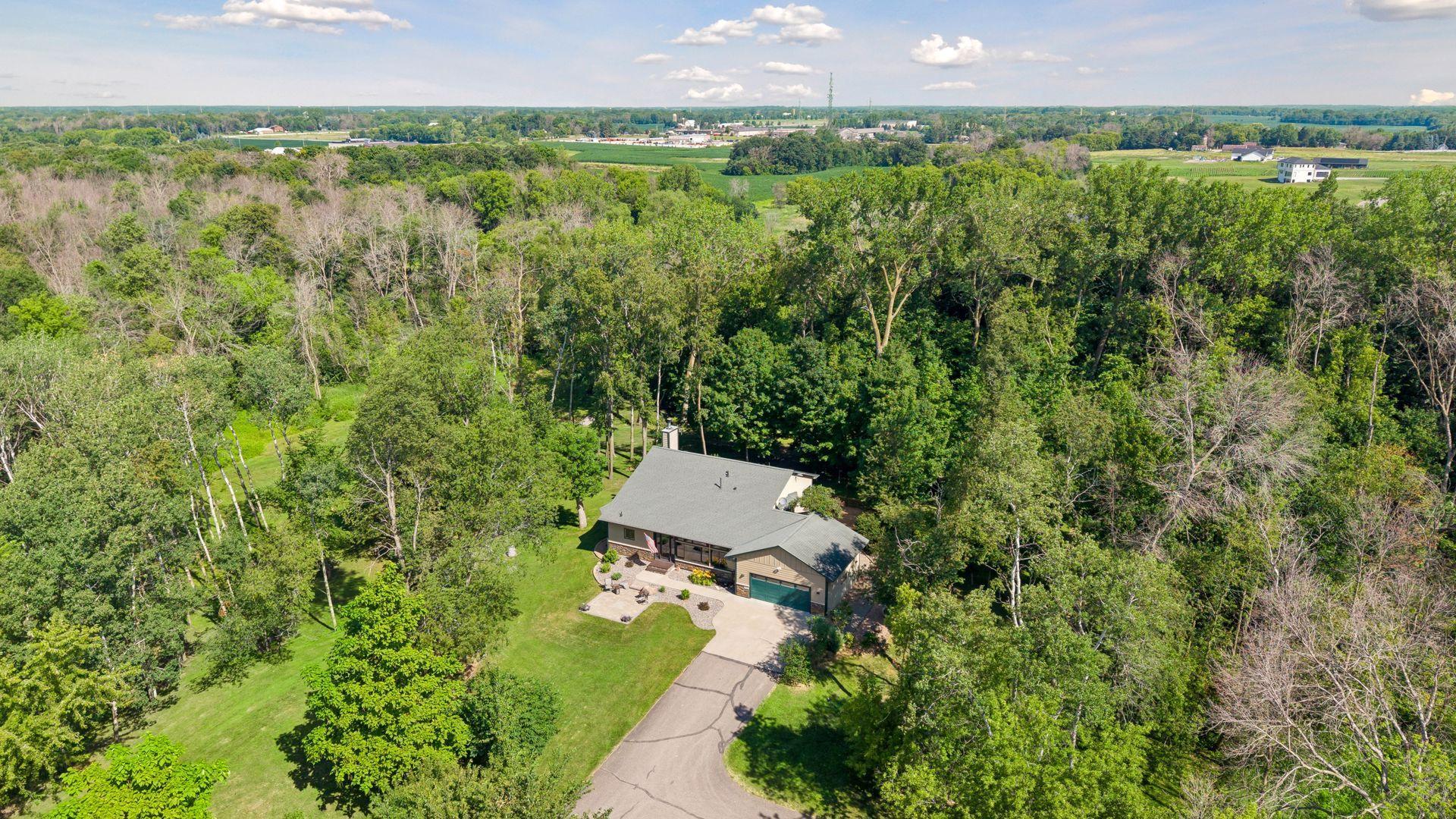 Welcome home to your quiet country escape, while still being close to every amenity in nearby Maple Grove and Rogers