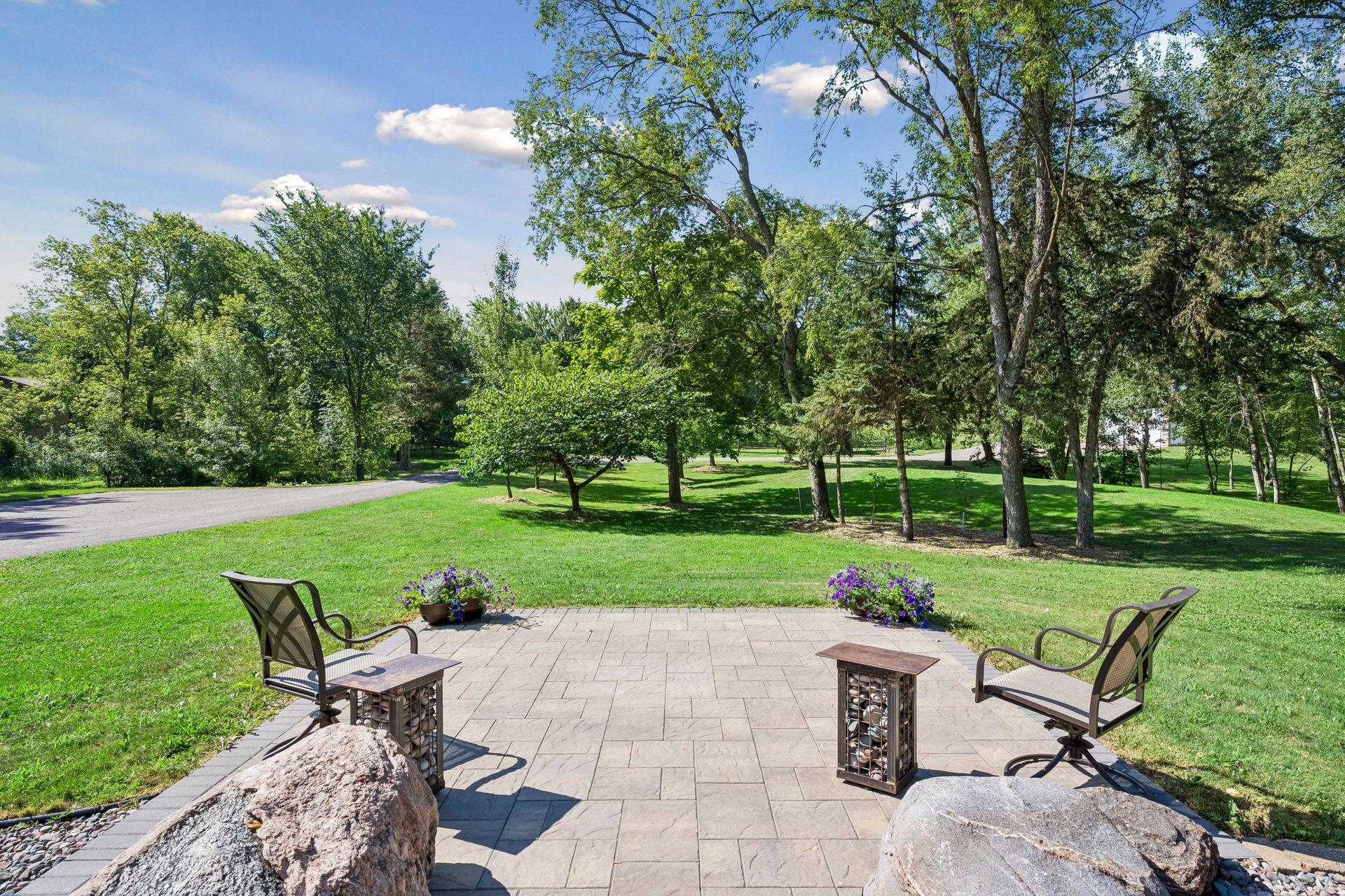 Views to the maples, fruit trees, garden and front pasture from the custom paver patio