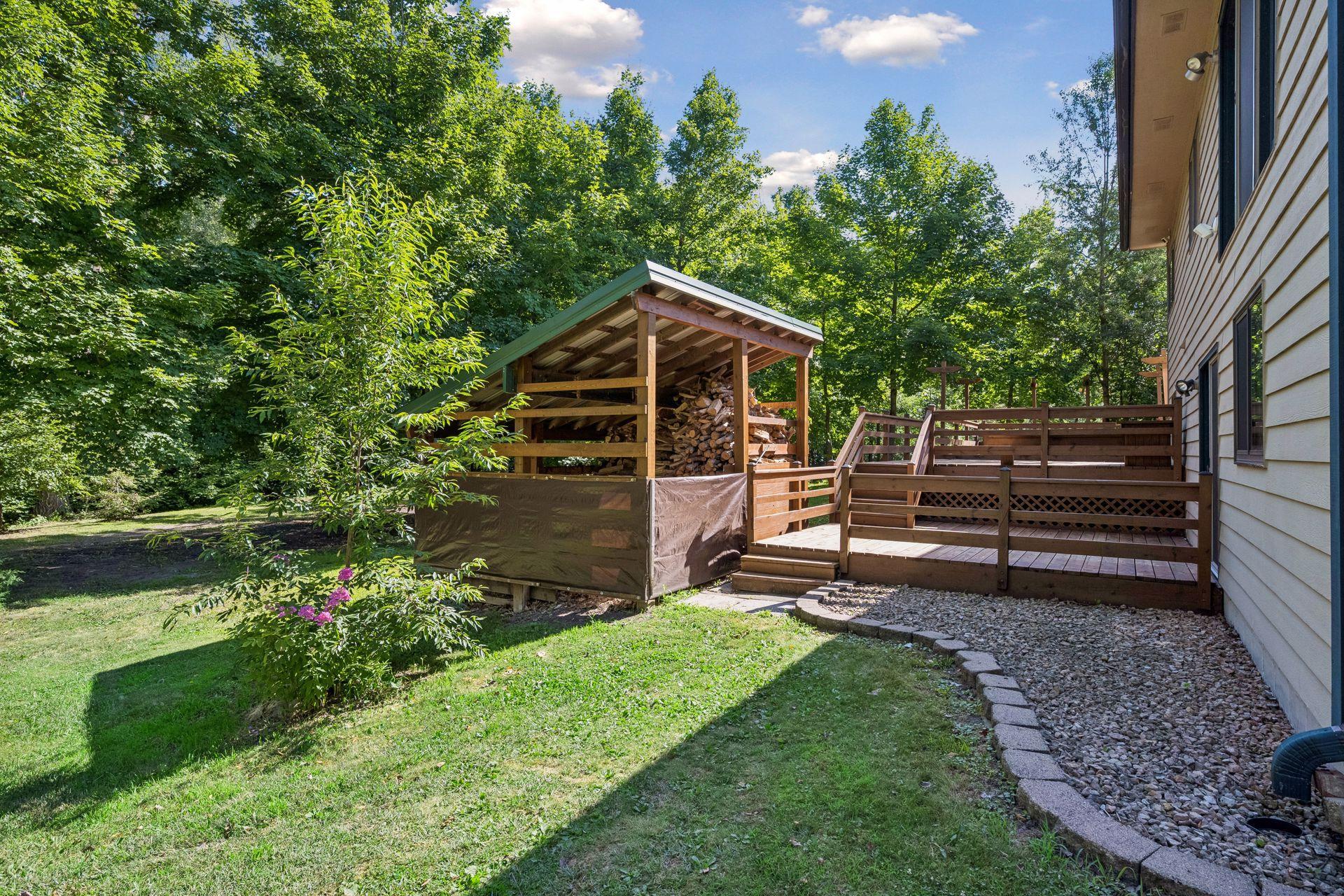 Solid wood storage shelter is built to last, or create an outdoor kitchen and bar