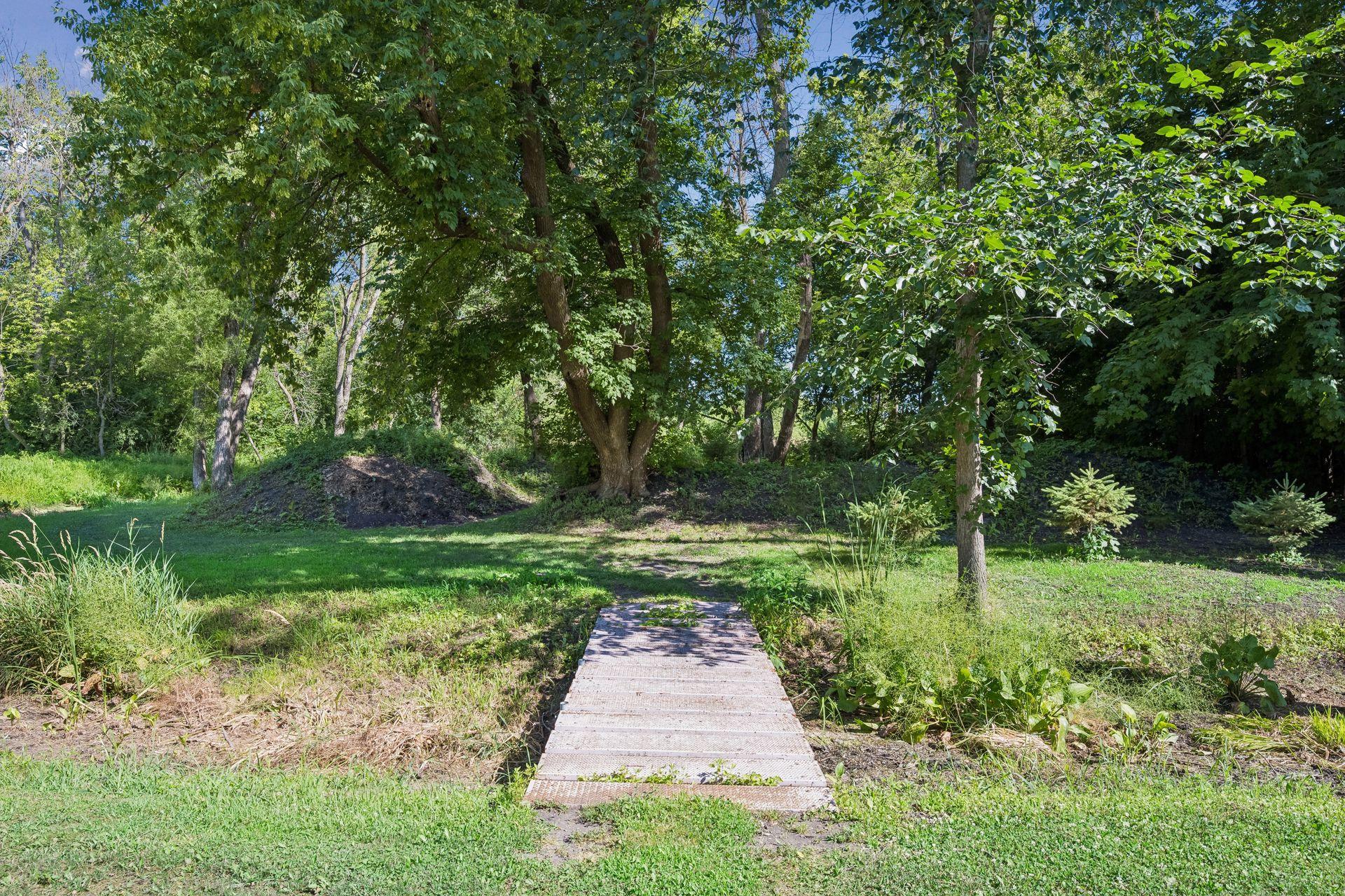 Explore nature in your own backyard trails through the woods, with a seasonal creek that flows through the property