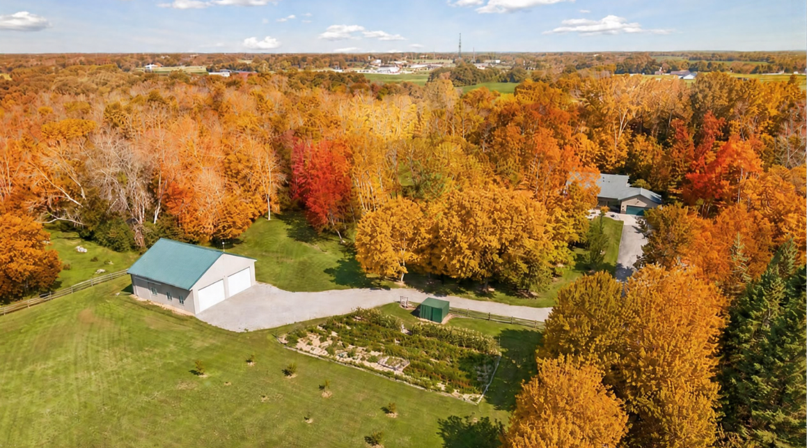 A 40' x 45' outbuilding provides versatile space for recreational equipment, an RV, or horse-related needs, while the surrounding open acreage offers endless possibilities for gardens, pasture, and outdoor enjoyment.