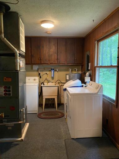 Utility Room/Laundry with door out to the back deck