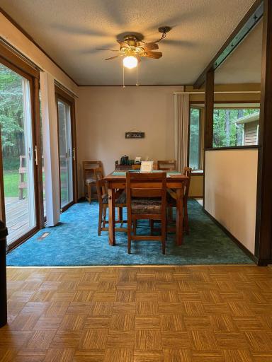 Dining area you can walk right out of the south facing sliding doors onto the wrap around deck