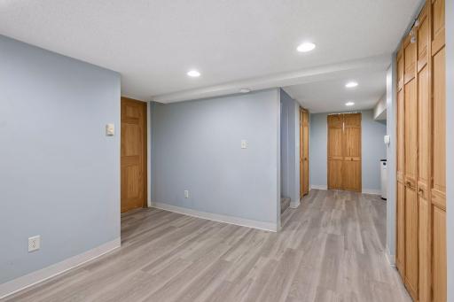 Versatile finished lower level ideal for a family room, office, workout area or play space.