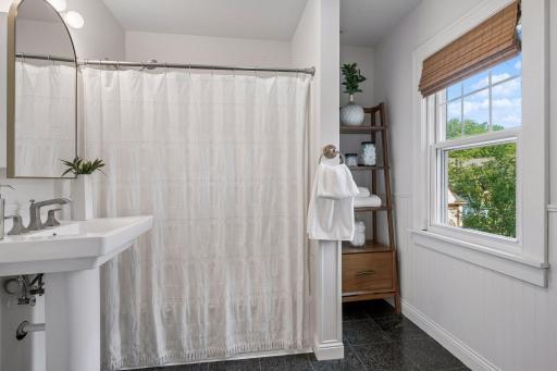 Full bath serving all three upper-level bedrooms.