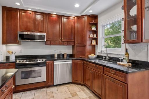 Updated kitchen appliances include refrigerator, dishwasher and microwave.