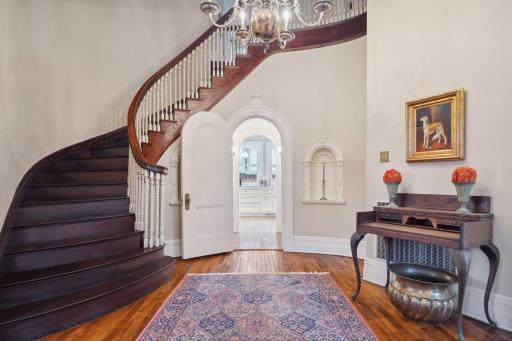 A graceful curved foyer welcomes you into the home's historic charm