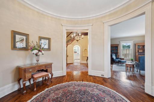The home's signature curved architecture is on full display from this central foyer