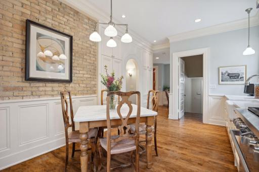 Charming breakfast nook with exposed brick accent wall