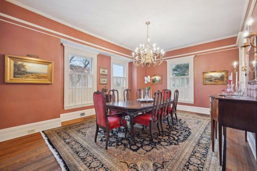 Formal dining room set beneath an elegant chandelier