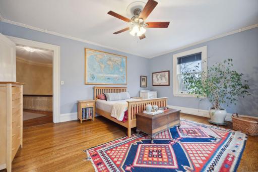 Large bedroom with fan and walk in closet