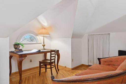 Charming reading nook tucked beneath the eaves.
